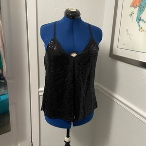 Black sequin top perfect for NYE! Size says S but it’s on a size 8 mannequin.